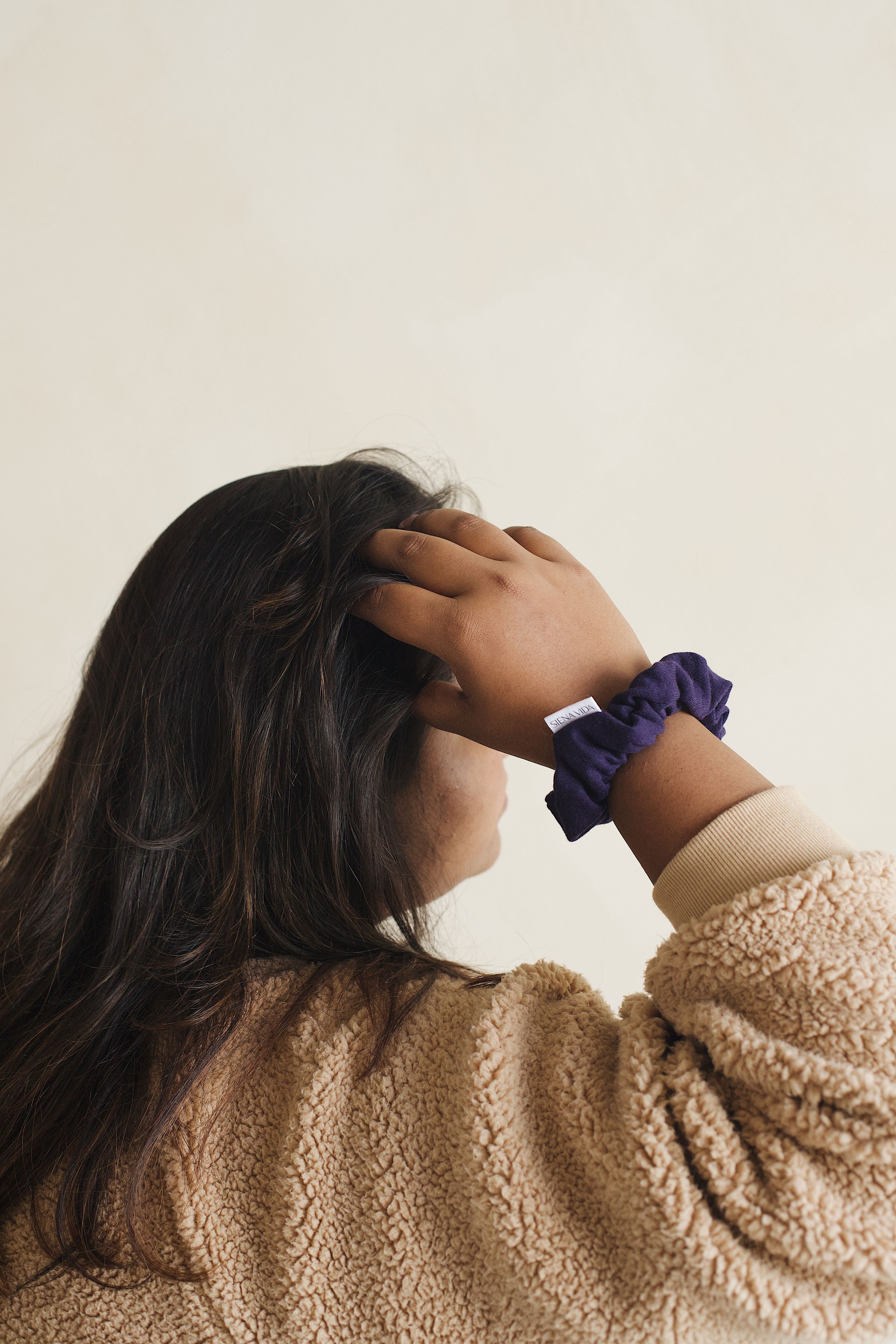 Blue/purple scrunchie in petite size on model's wrist