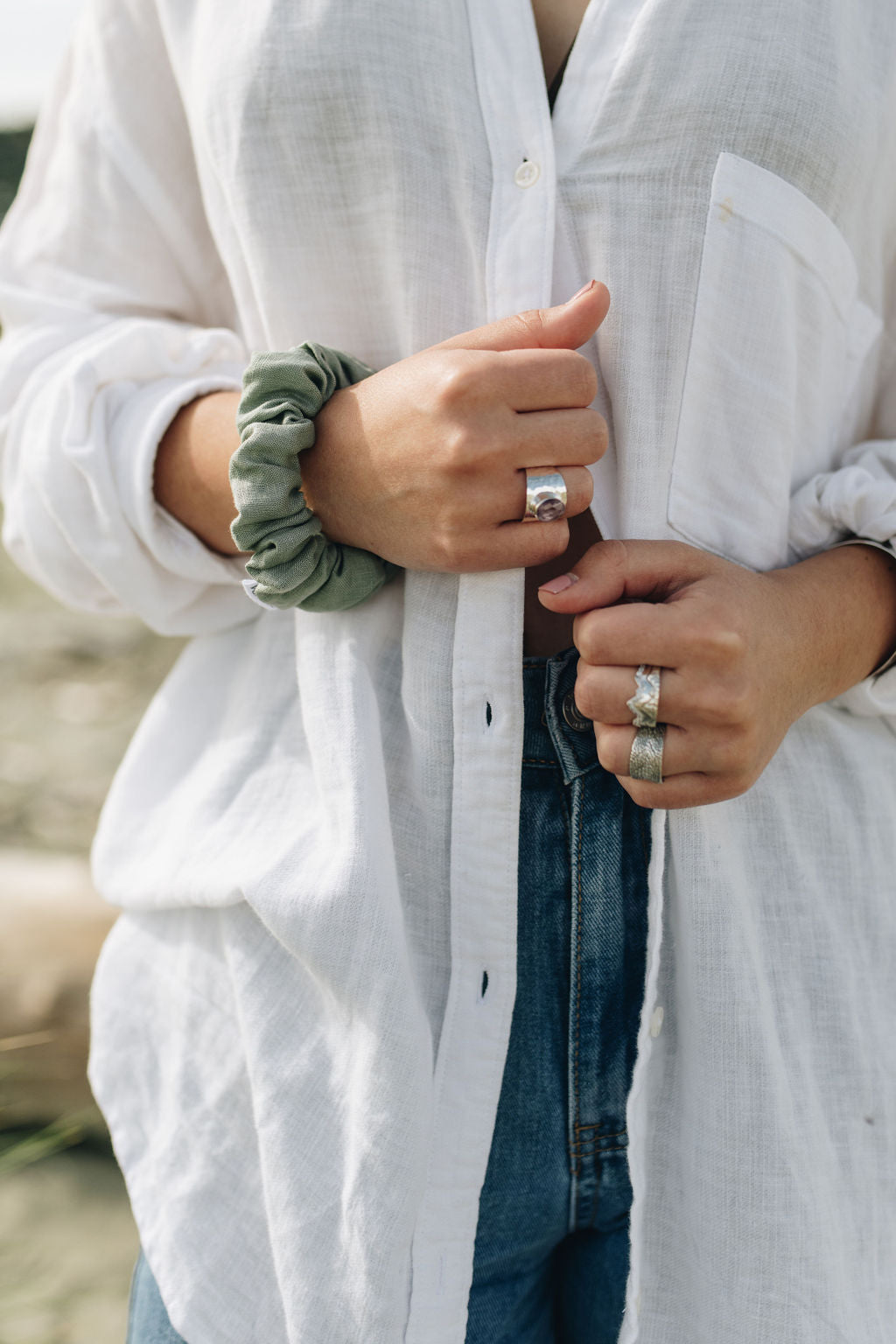 Sage Linen Scrunchie in petite size on model's wrist