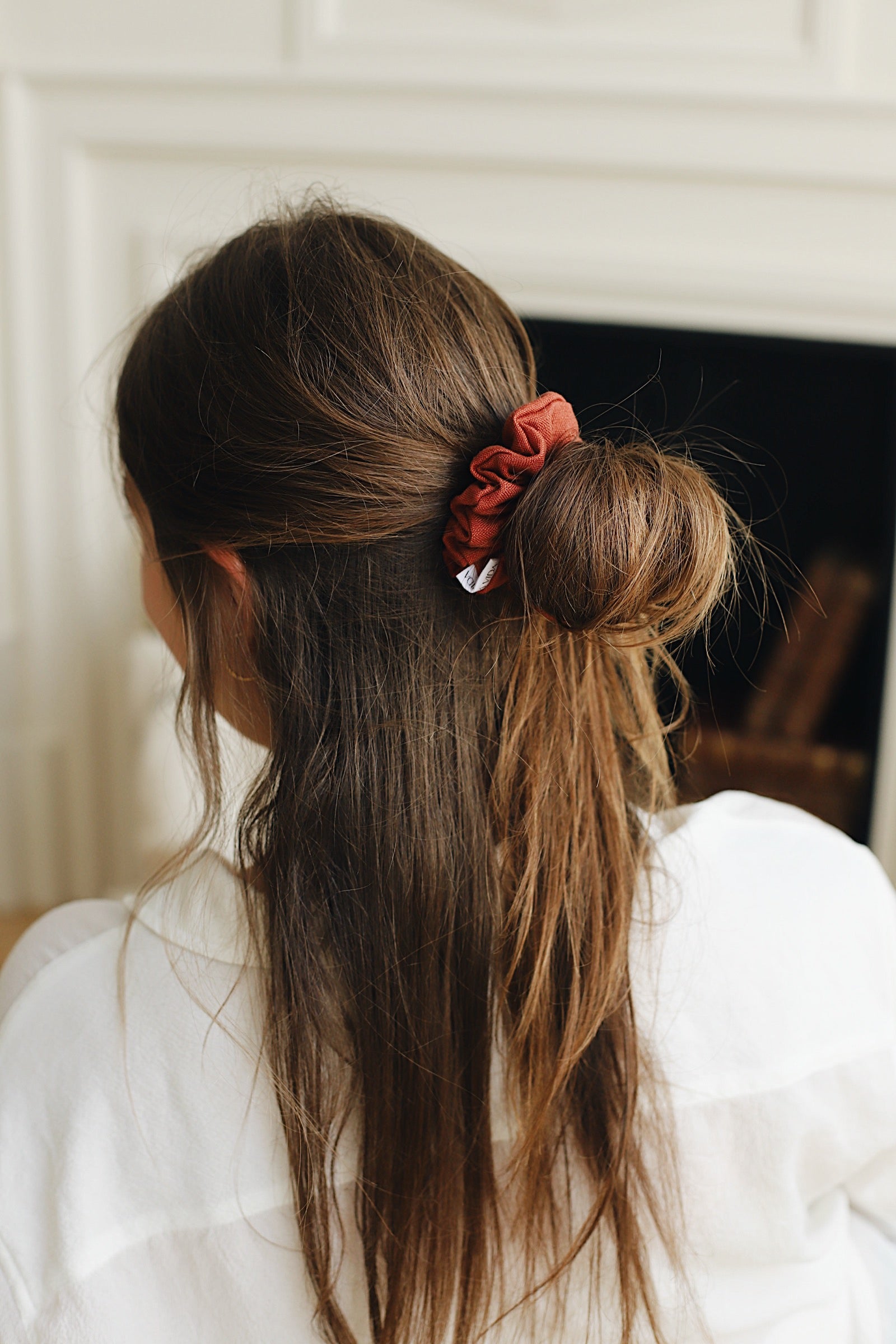 Terracotta Linen Scrunchie in model's half up half down hairstyle