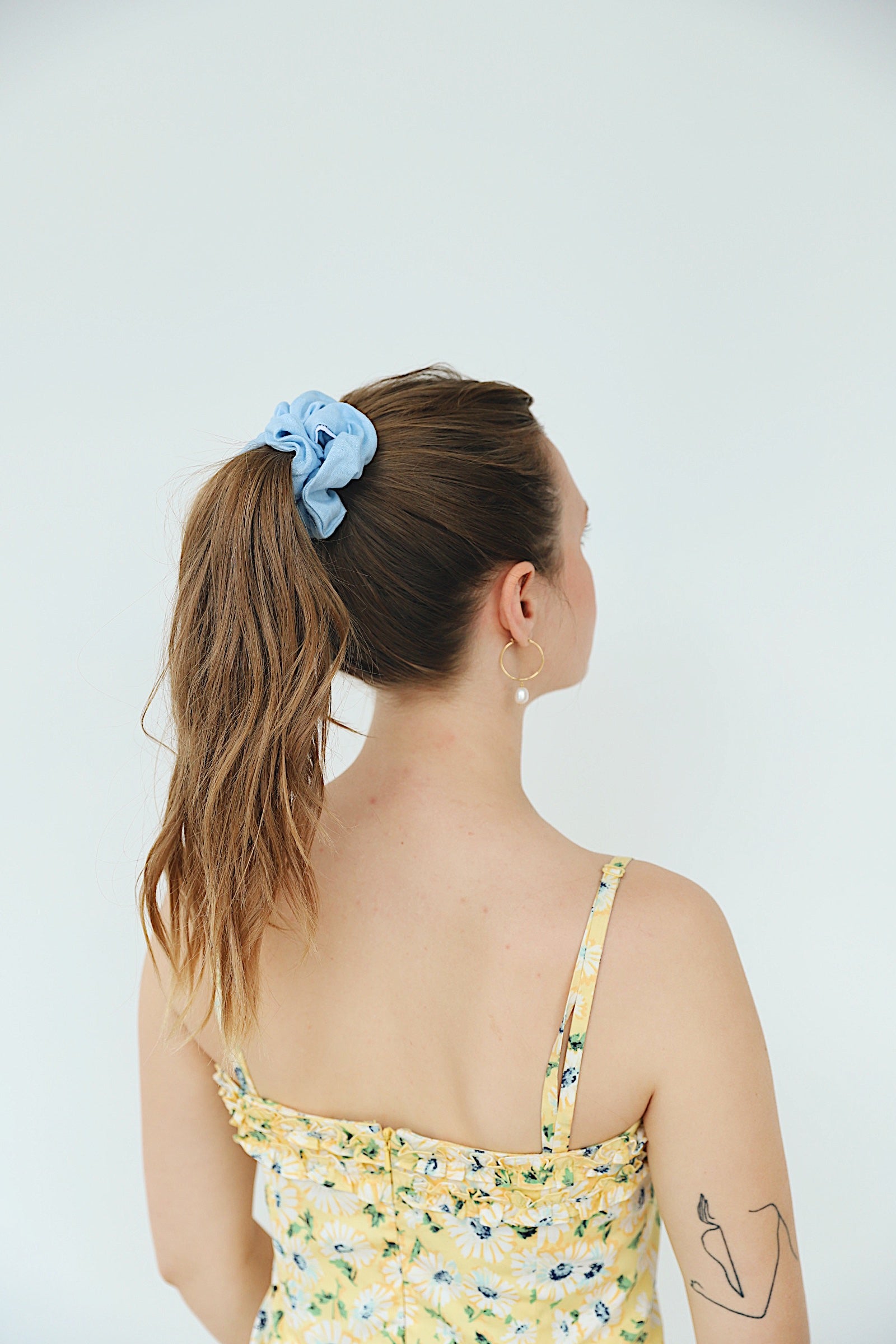 Baby Blue Linen Scrunchie in Classic size in model's ponytail