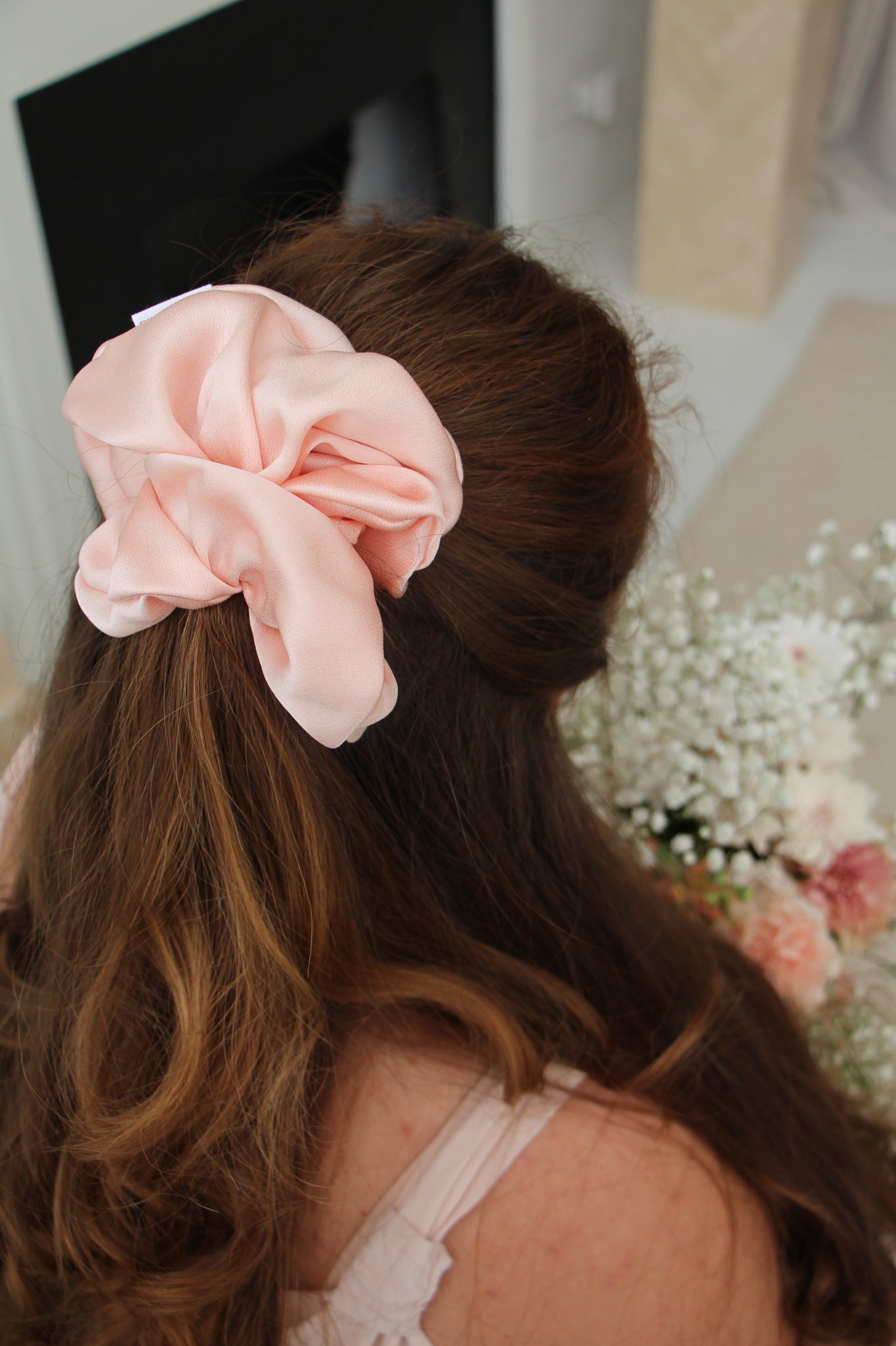 Petal Pink Silk XXL Scrunchie in model's ponytail.