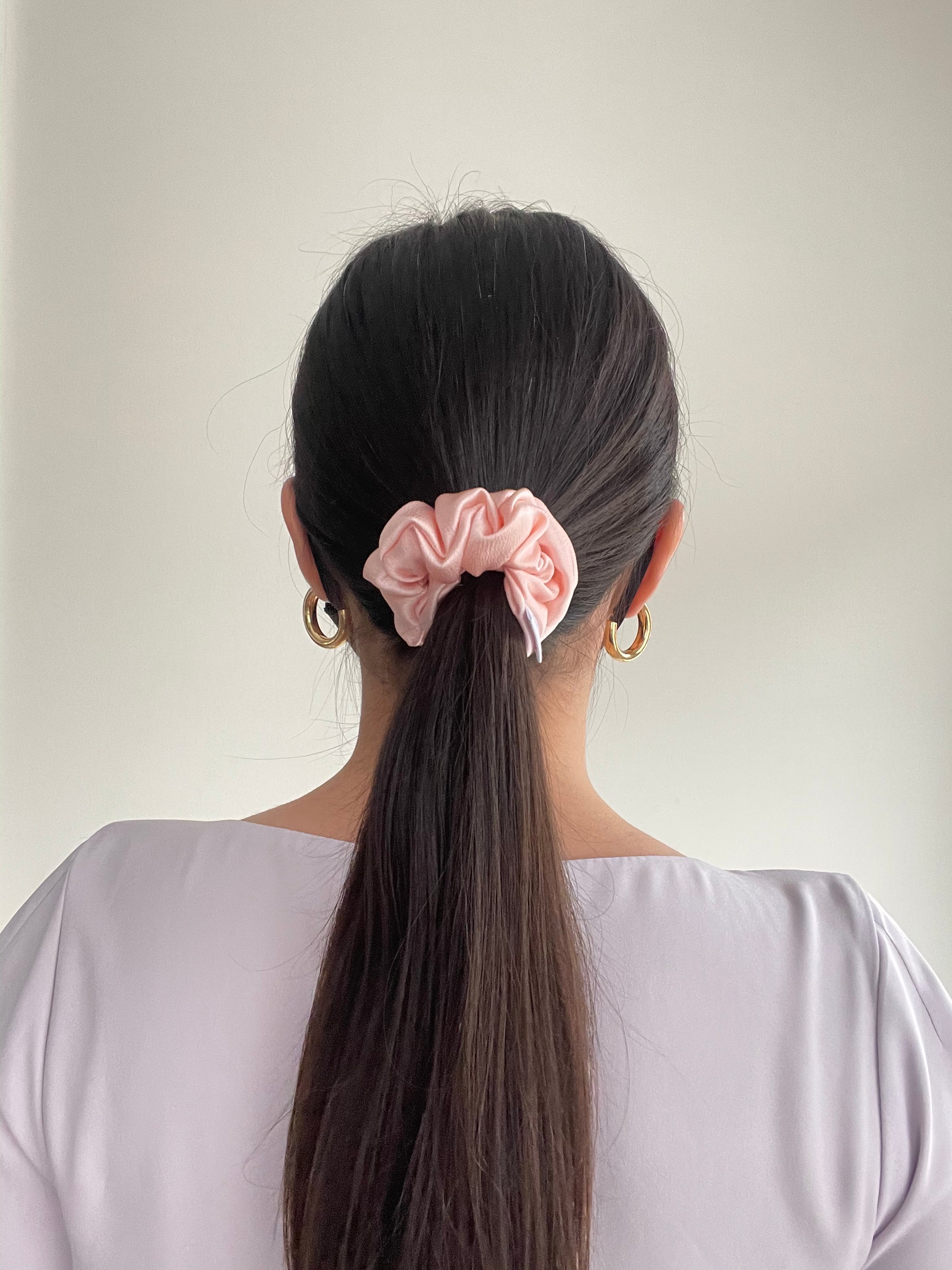thin Petal Pink Silk Scrunchie in model's hair