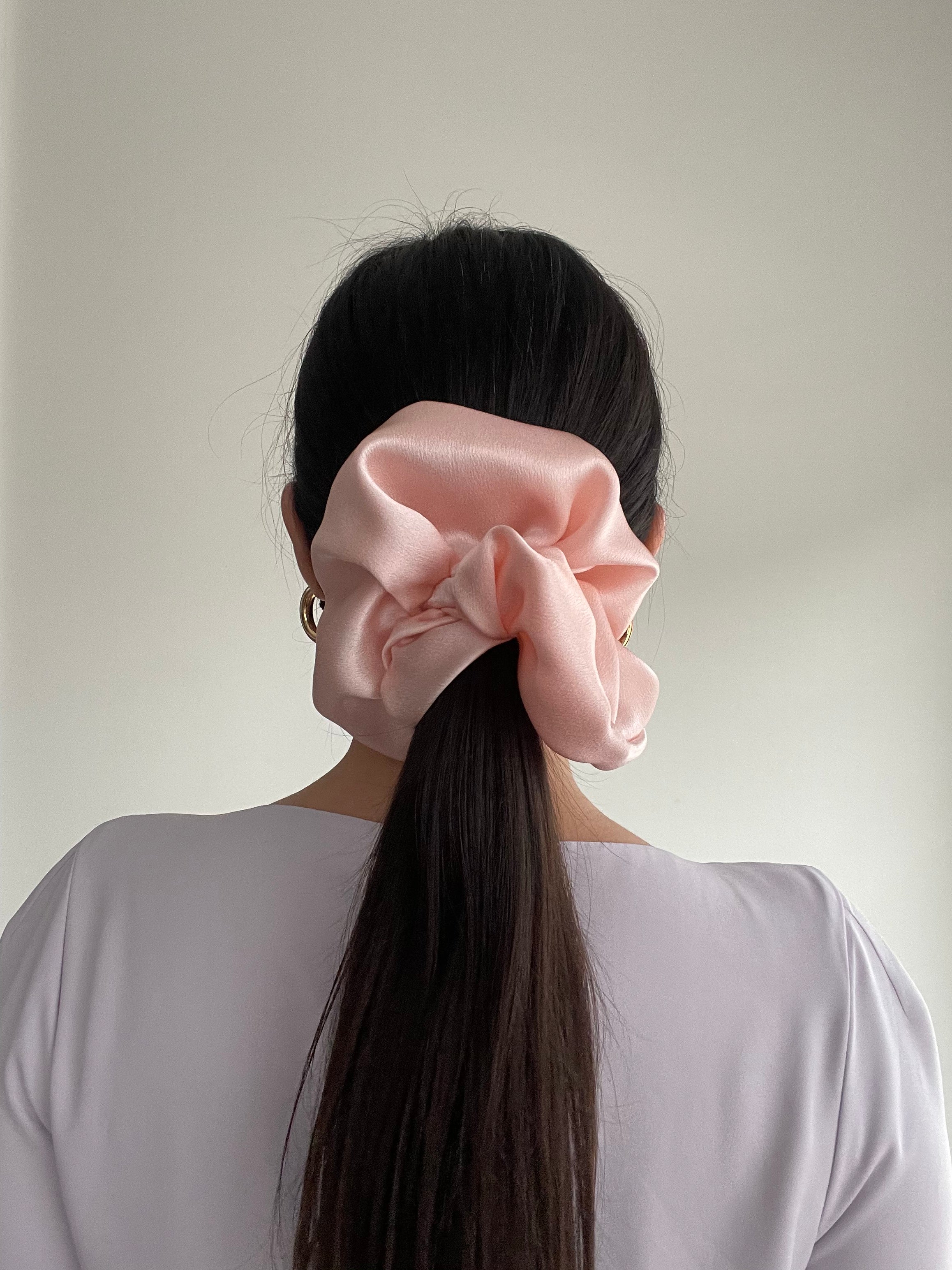 Petal Pink Silk Scrunchie in Cloud size in model's hair
