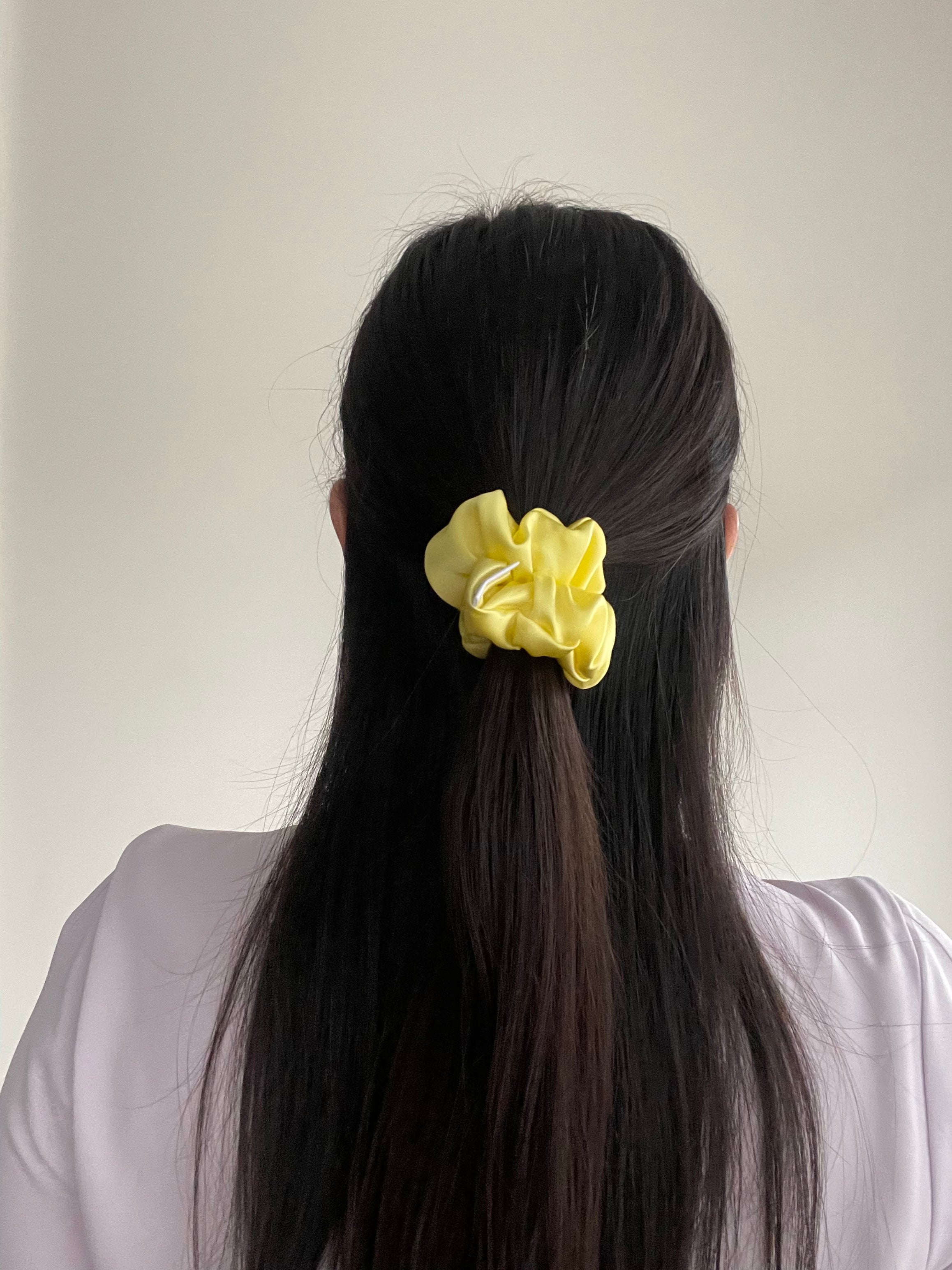 Lemon Silk Scrunchie in Beau size in Woman's half up half down ponytail.
